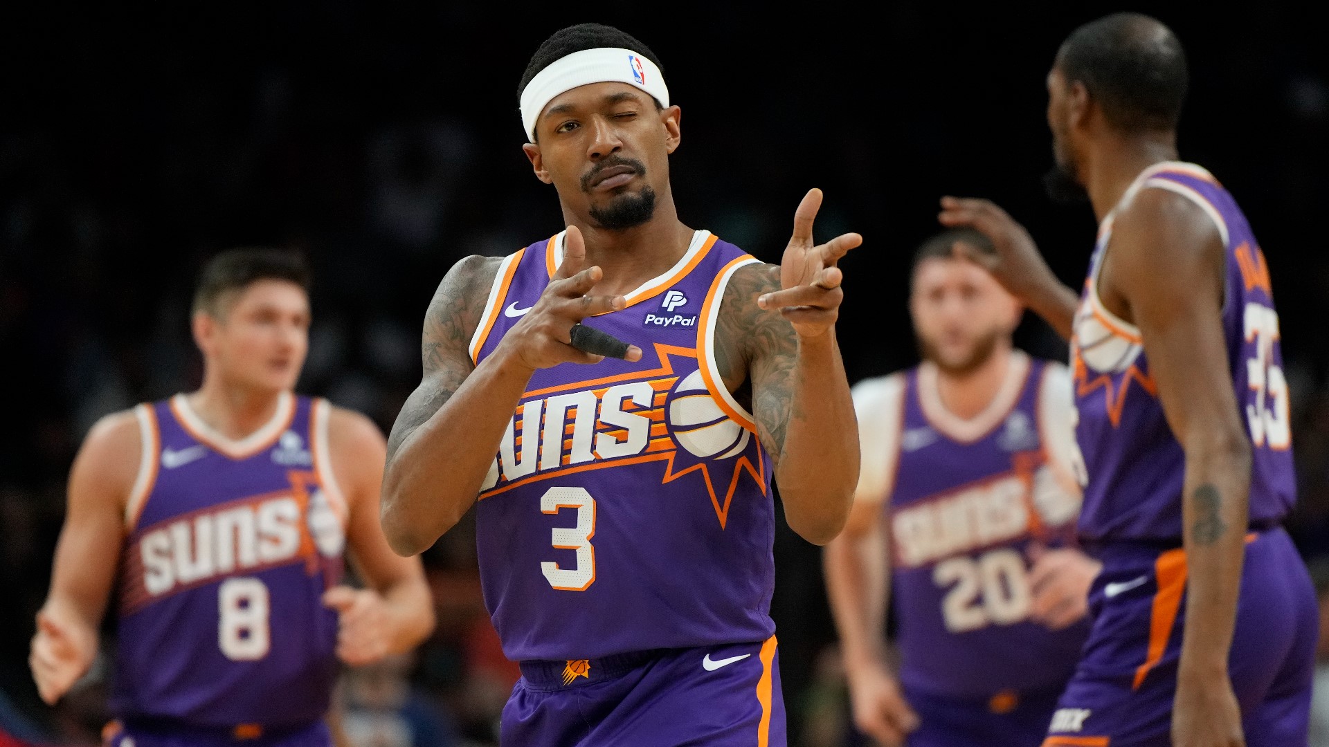 Suns guard Bradley Beal points toward the crowd after scoring against the Pelicans Sunday, April 7, 2024, in Phoenix. (AP Photo/Rick Scuteri)