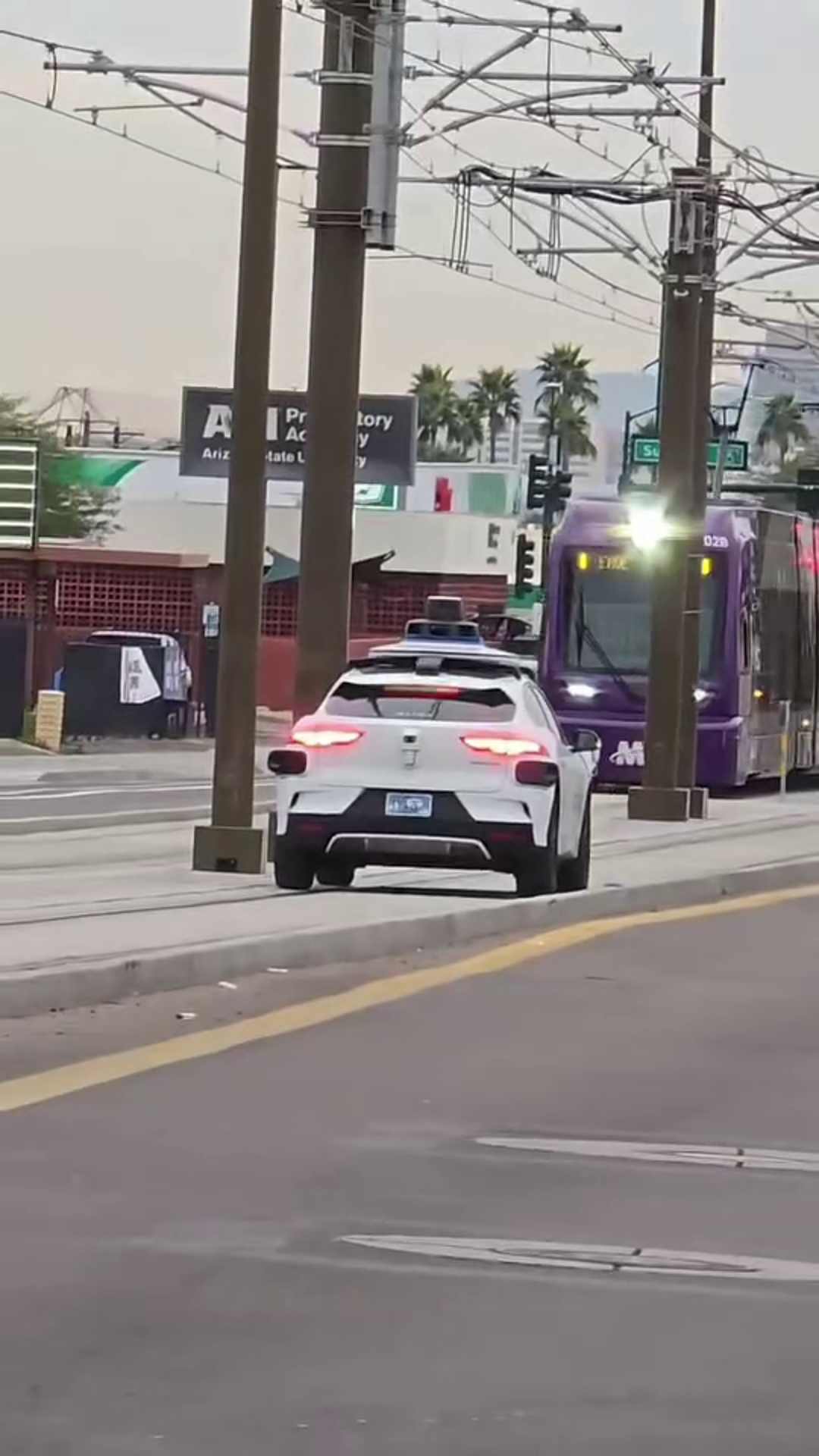 Waymo car seen driving on light rail tracks in Phoenix | 12news.com