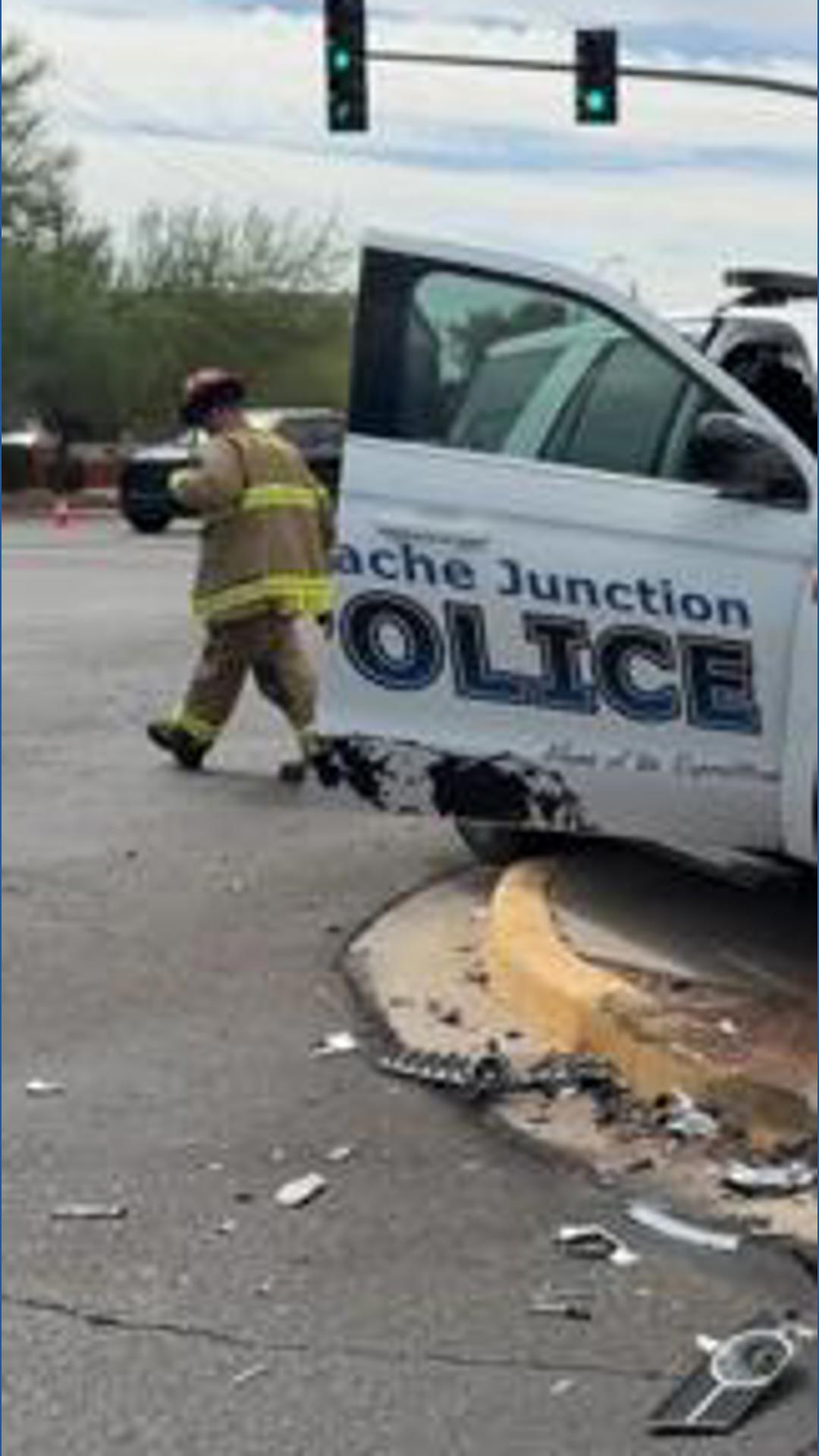 The police officer and another driver were taken to a local hospital Tuesday morning.