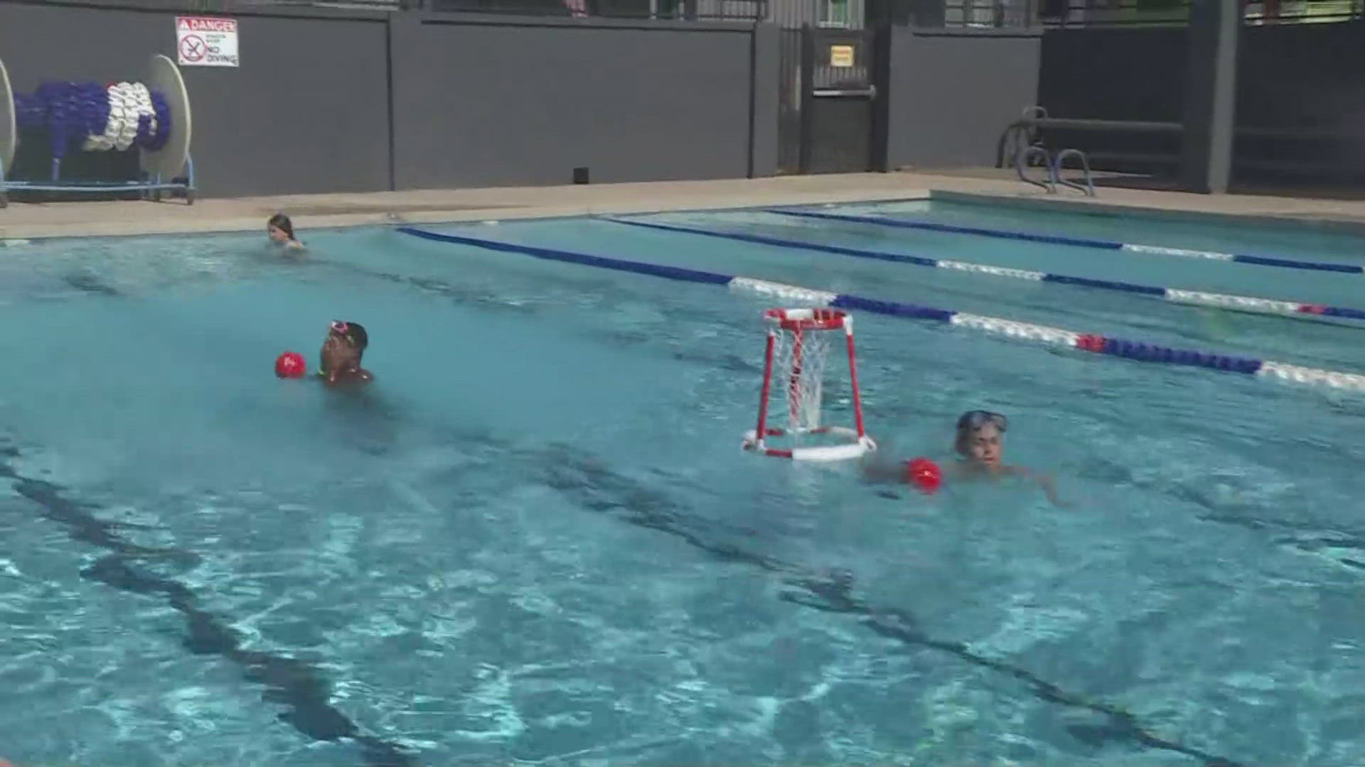 12News journalist Rachel Cole talks with a lifeguard sharing safety tips around water.