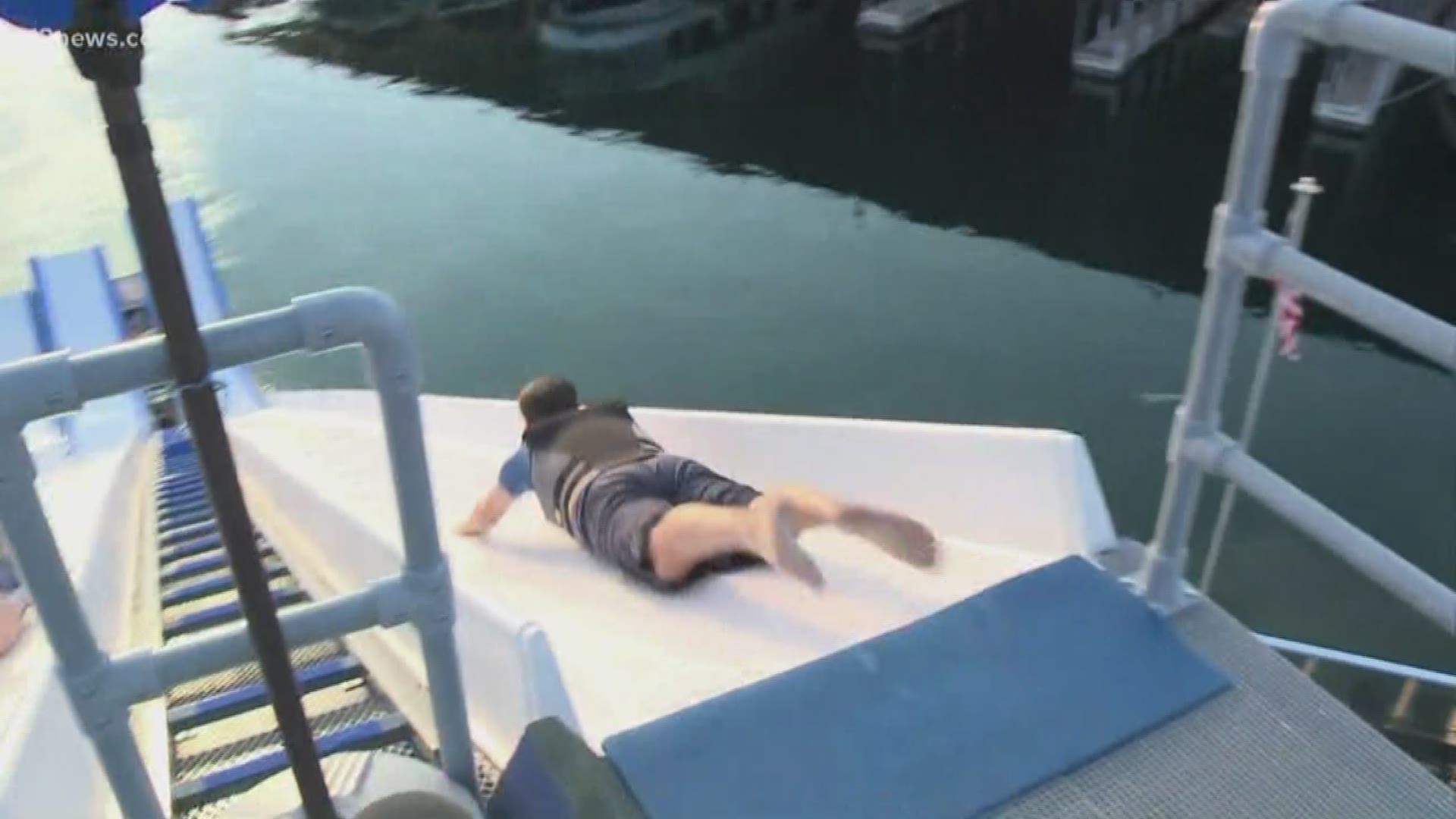 Team 12's Bryan West braves the world's tallest floating water slide.