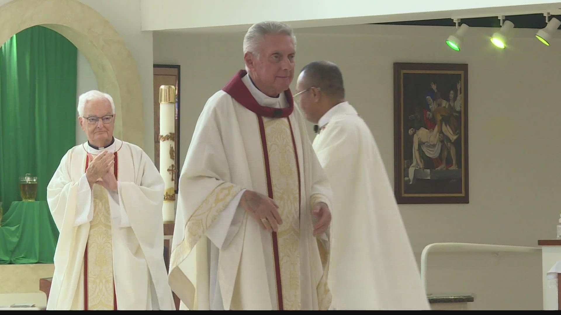 There was a standing ovation on Sunday for Father Robert Caruso who is stepping down as priest of All Saints Roman Catholic Church in Mesa.