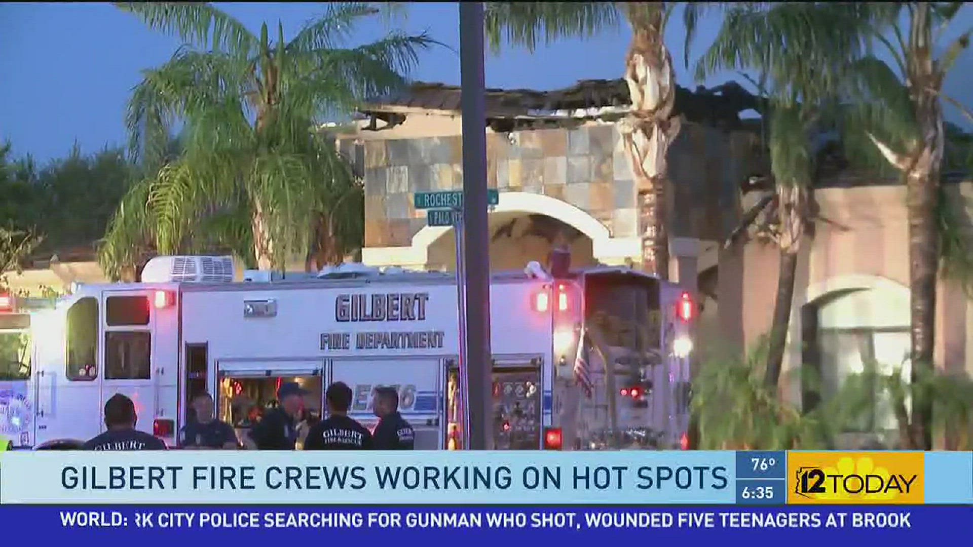 Crews continue to work on a smoldering house fire that destroyed a 6700 square-foot house in Gilbert.