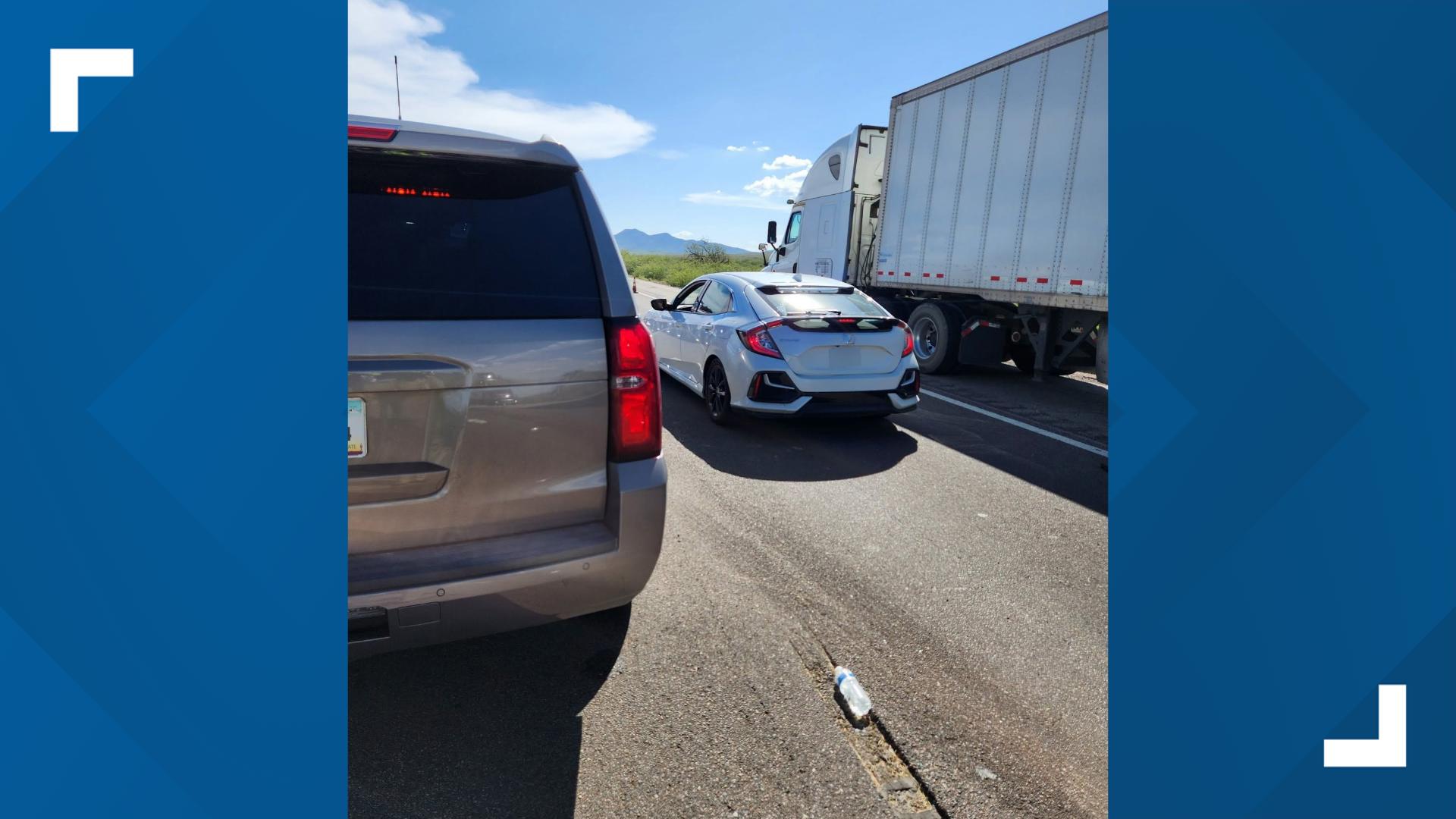 Sixteen drivers were cited for breaking Arizona's hands-free law while passing by a crash on I-10, according to state troopers.