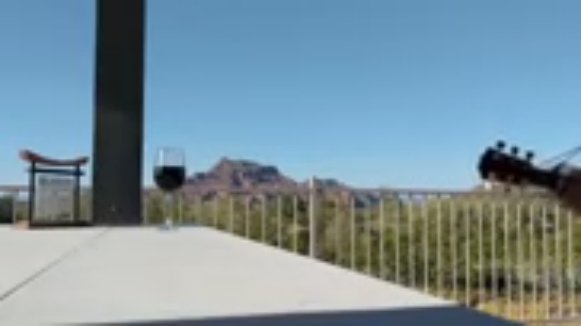 Tim Maas plays guitar and sings every night with the Red Mountain in the background to give people hope during quarantine.