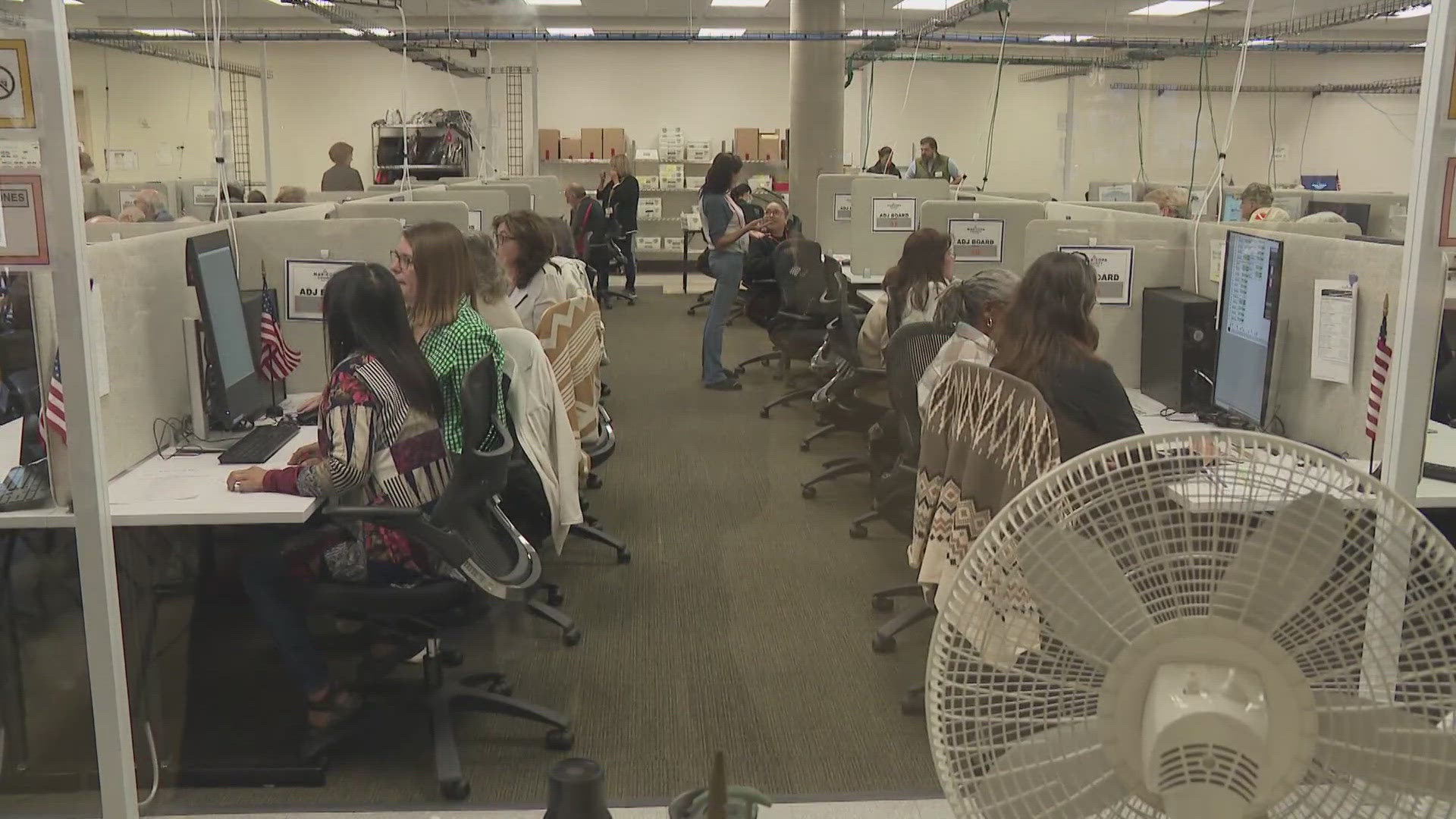 Ballot counts continue to update as workers continue to count votes at the tabulation center.