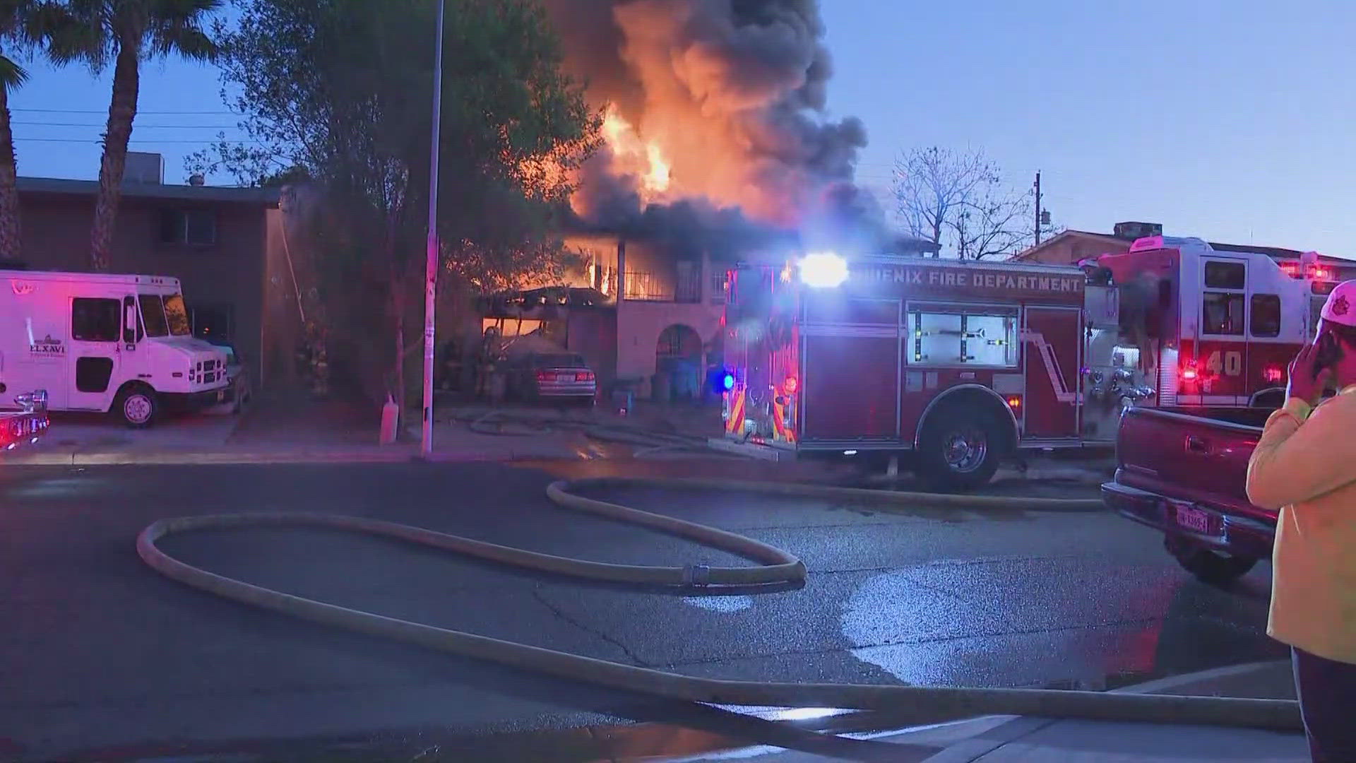 Crews battle a house fire near 83rd Avenue and Osborn Road on Tuesday morning.