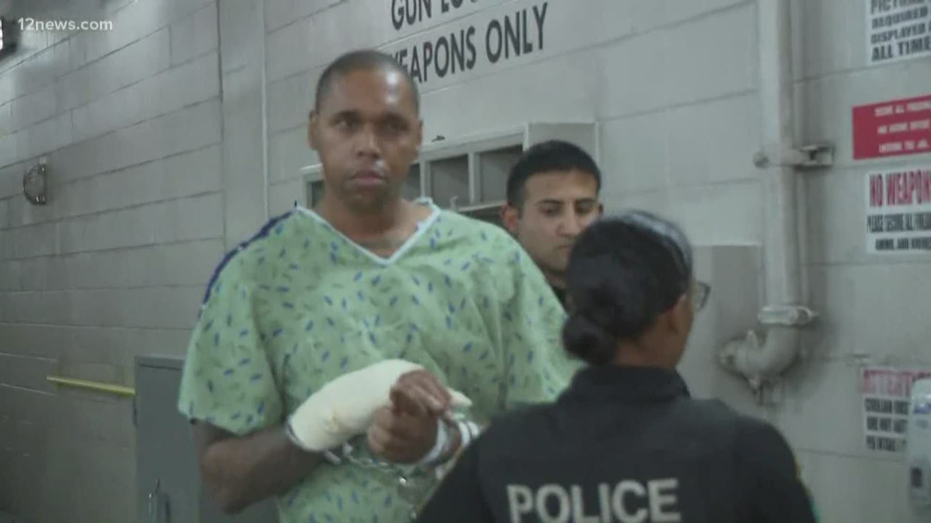 12 News cameras caught Julius Grant, accused of murdering a man at a Glendale workplace, being walked into the Fourth Avenue Jail Wednesday night.