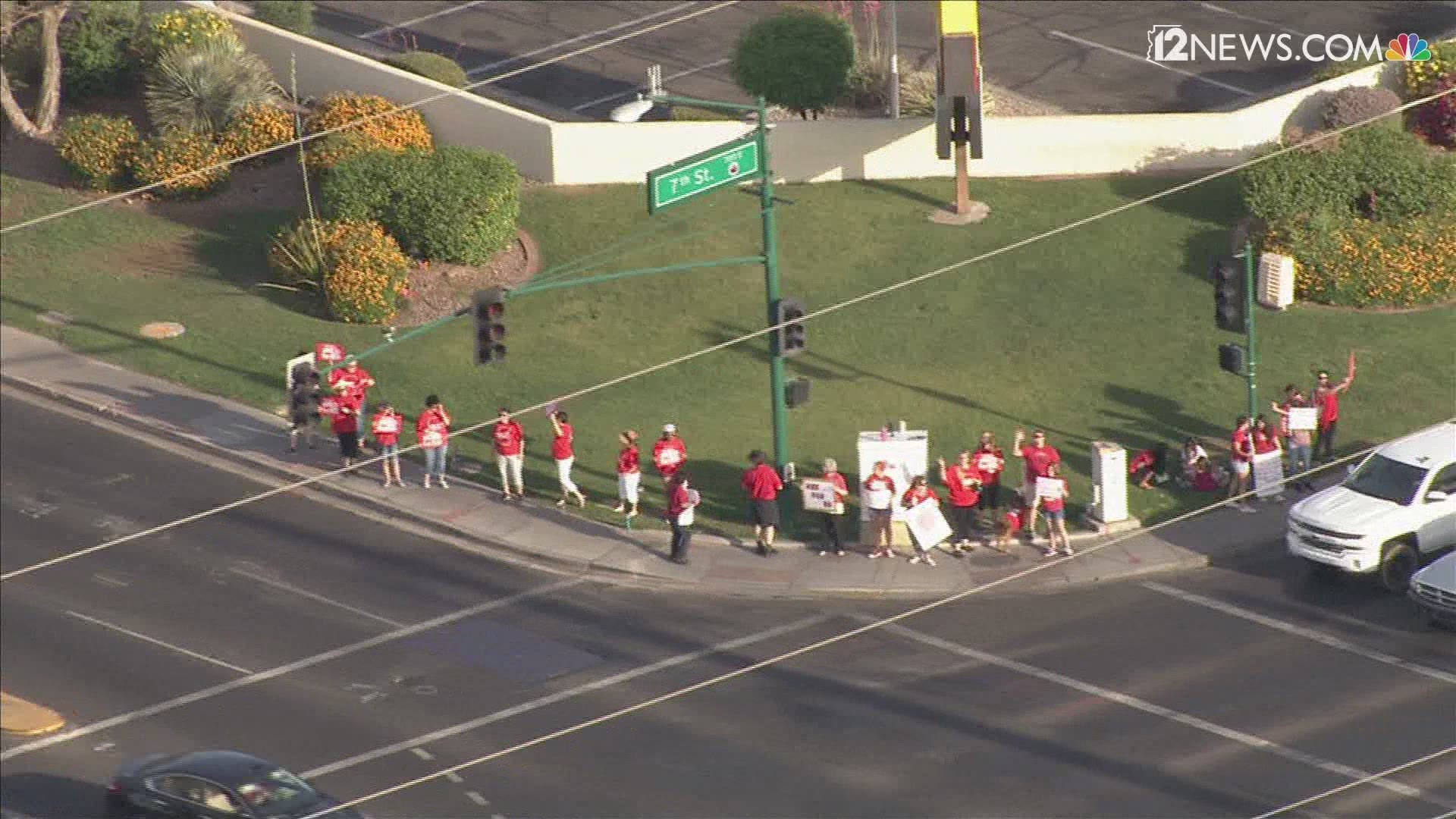 Teachers march in support of the #RedForEd movement for public education investment.