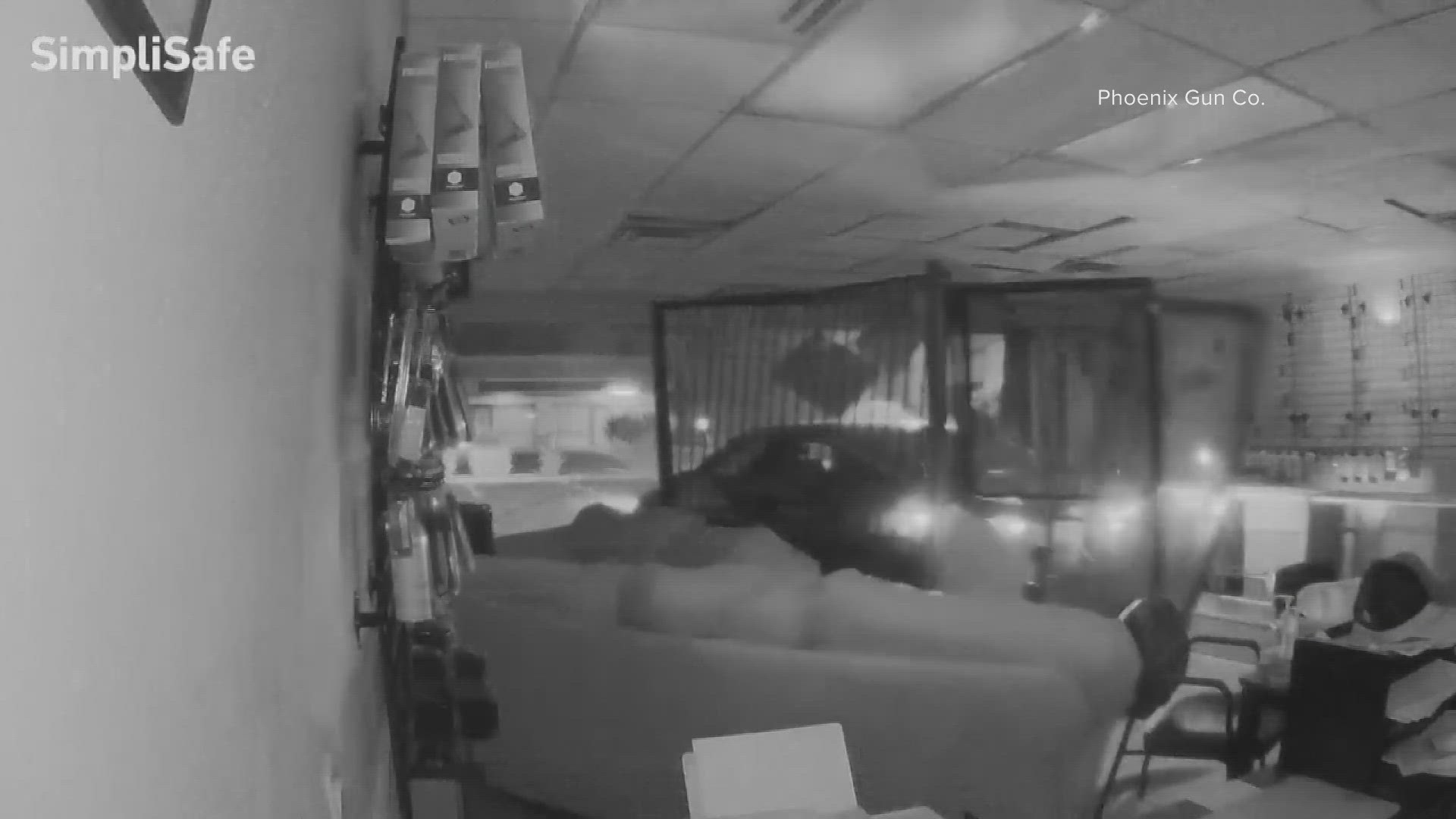 A group of burglars smashed a car into a Phoenix firearm store Saturday morning and stole about $1,000 in merchandise. But they didn't walk out with any guns.