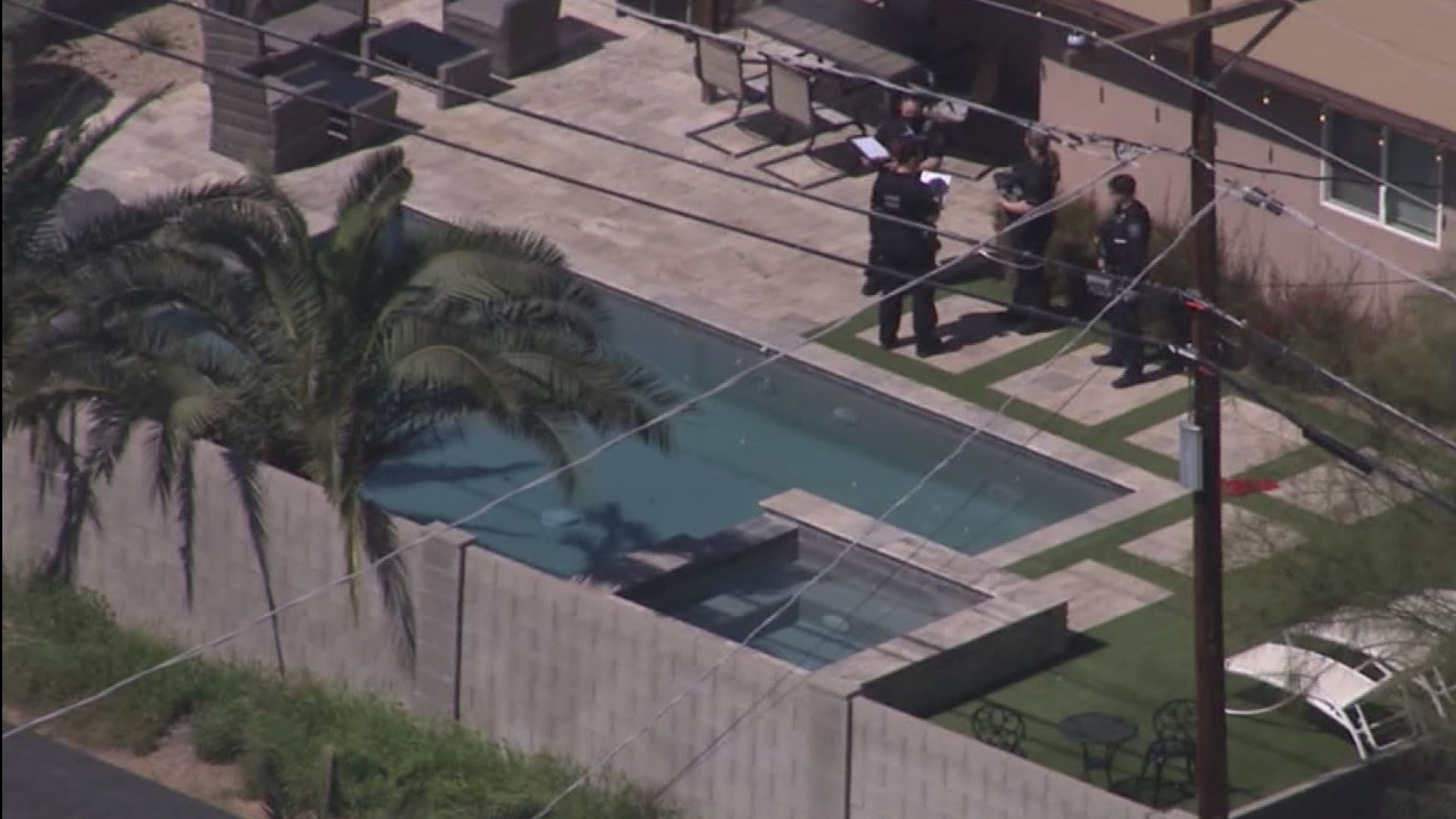 The young child died at the hospital after a drowning incident at a neighbor's pool, police said.