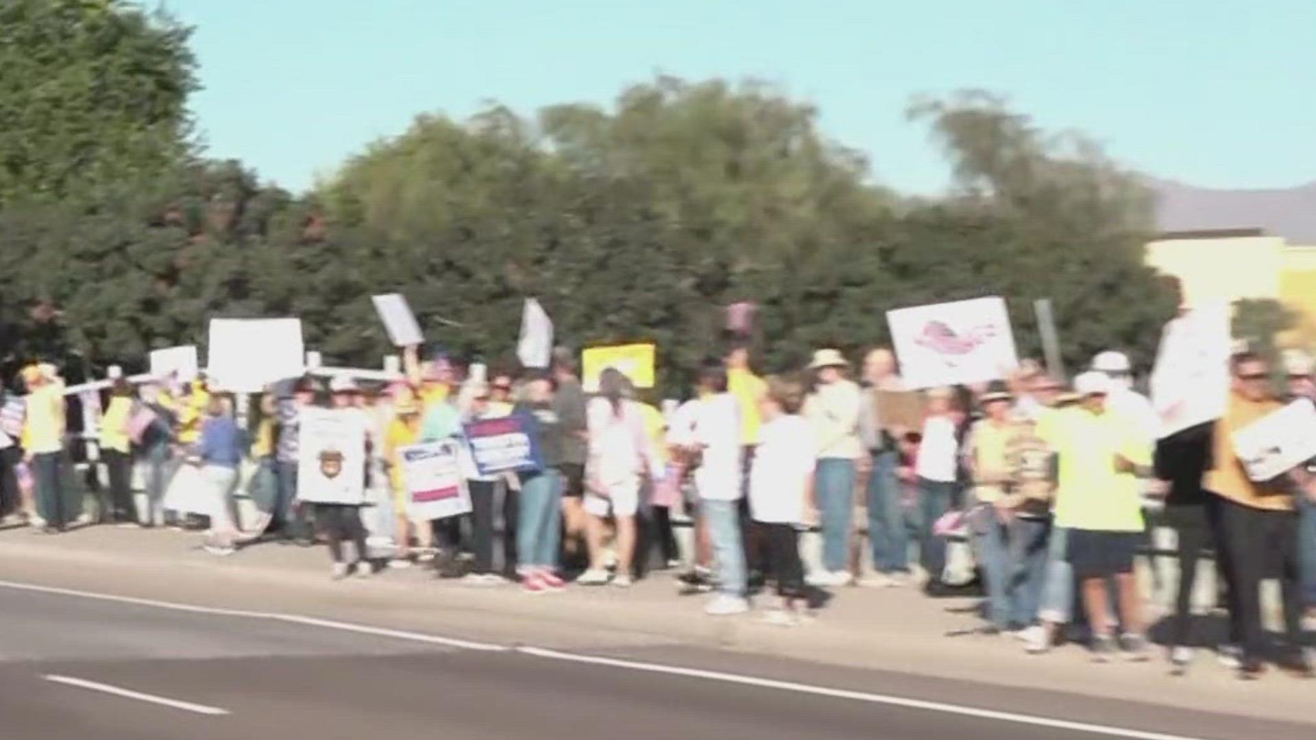Protesters lined McDowell Road in Goodyear at a "No Kings" rally.
