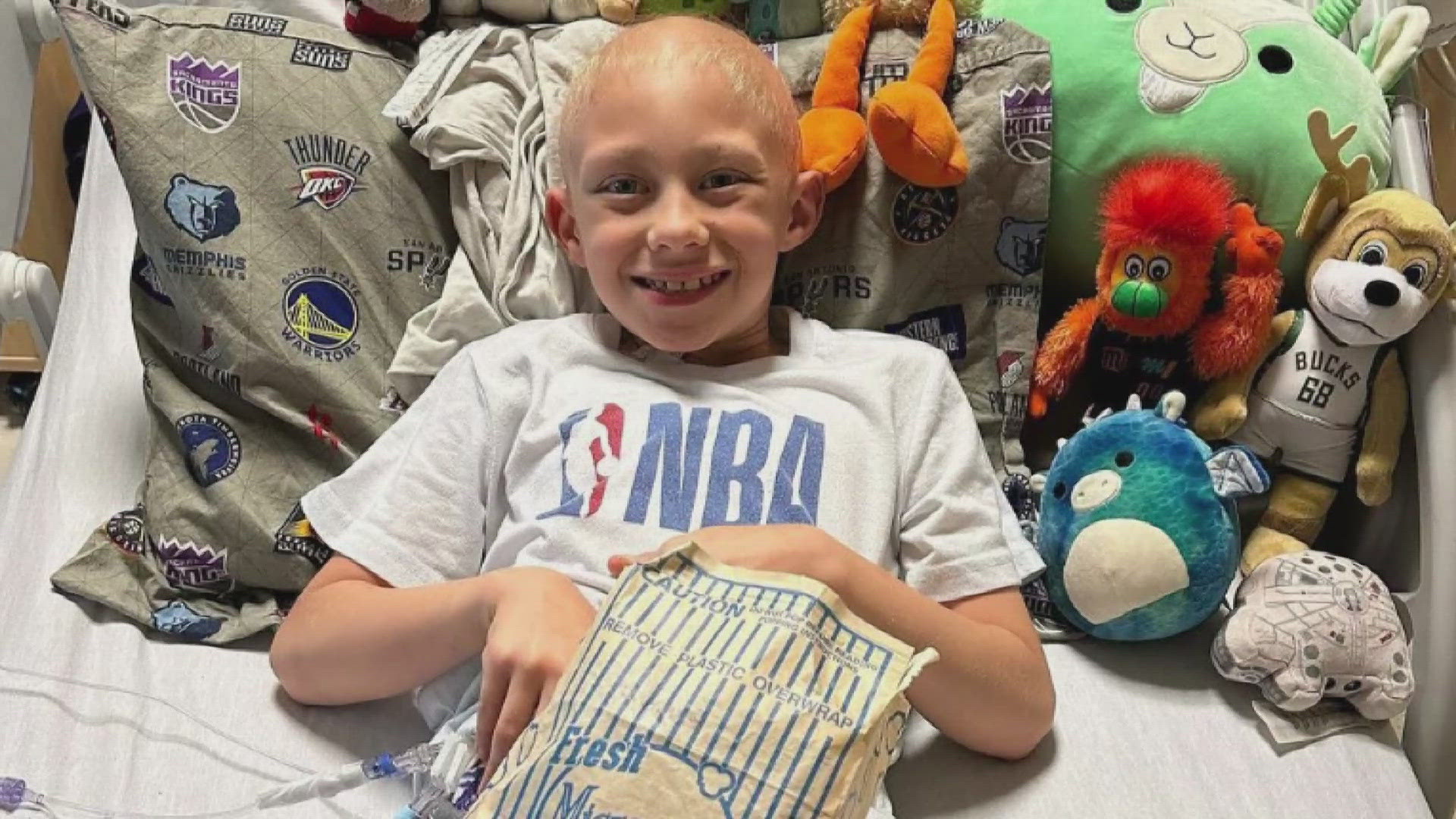 The young fan isn't letting his cancer battle get in the way of enjoying the joy of basketball.