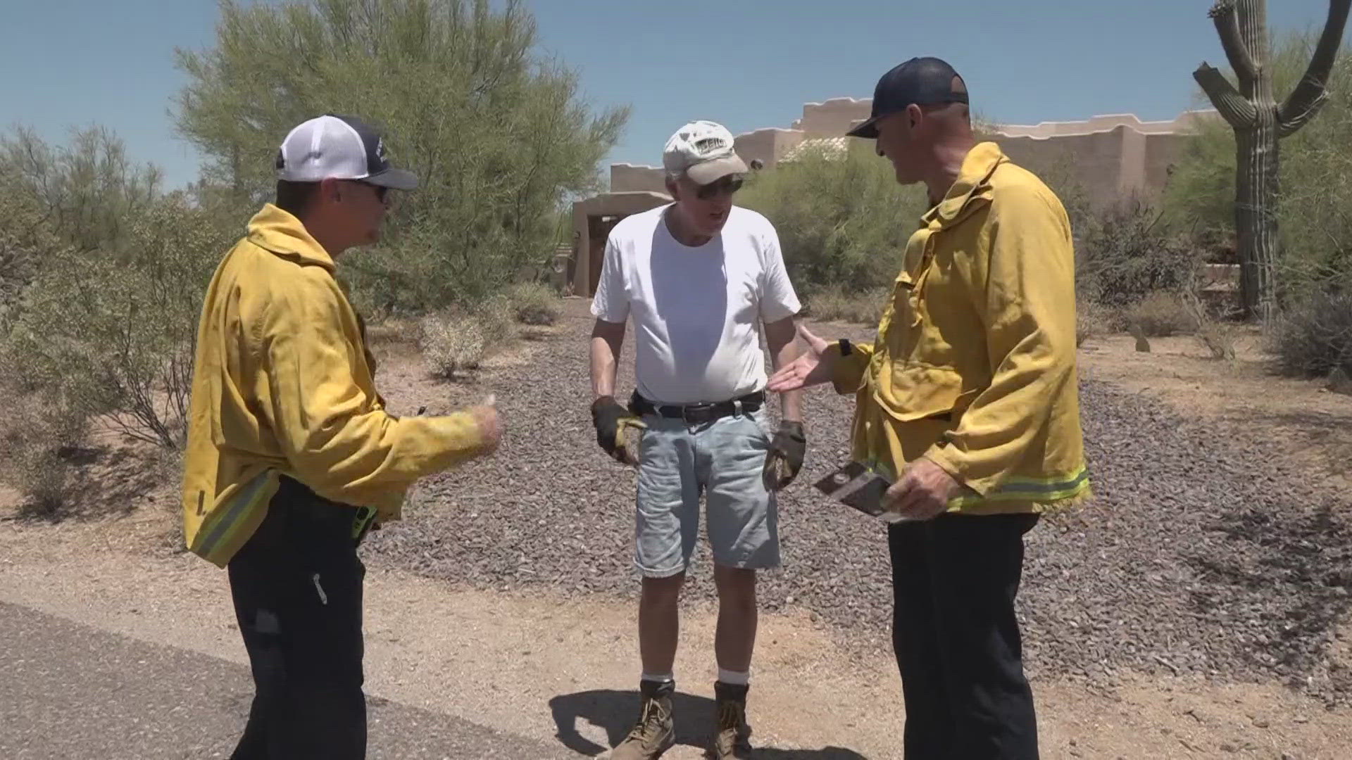 With wildfire season in full swing, firefighters from the Scottsdale Fire Department examine neighborhoods for potential home fire dangers.