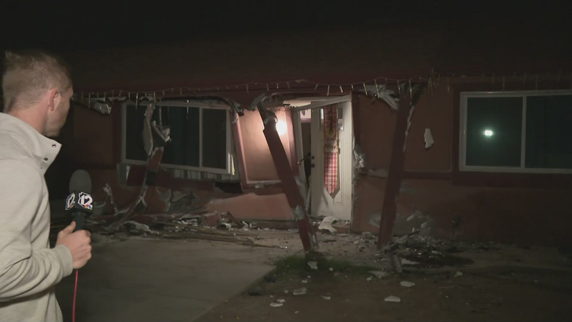 The crash happened at 59th Avenue and McDowell Road, causing significant damage to the building's exterior.