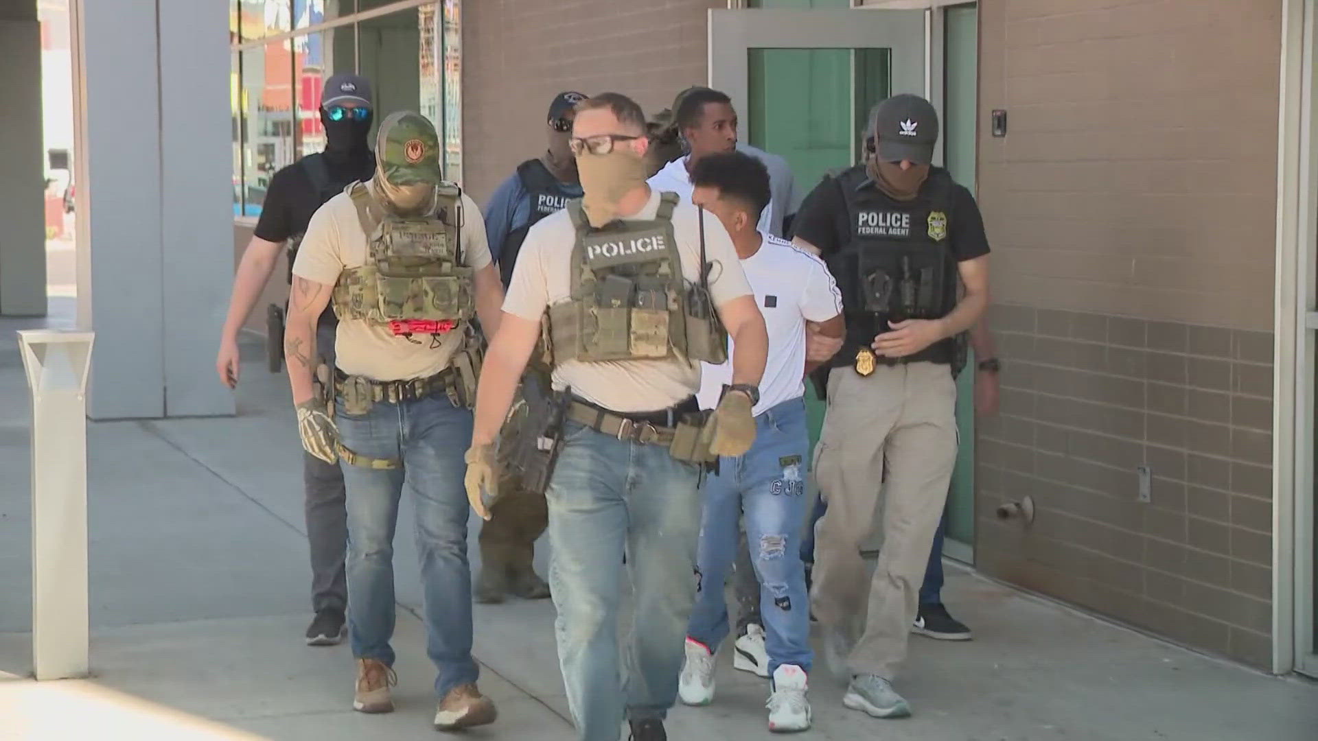 Bystanders have begun forming protests against mass arrests being made outside of an immigration court in Phoenix.