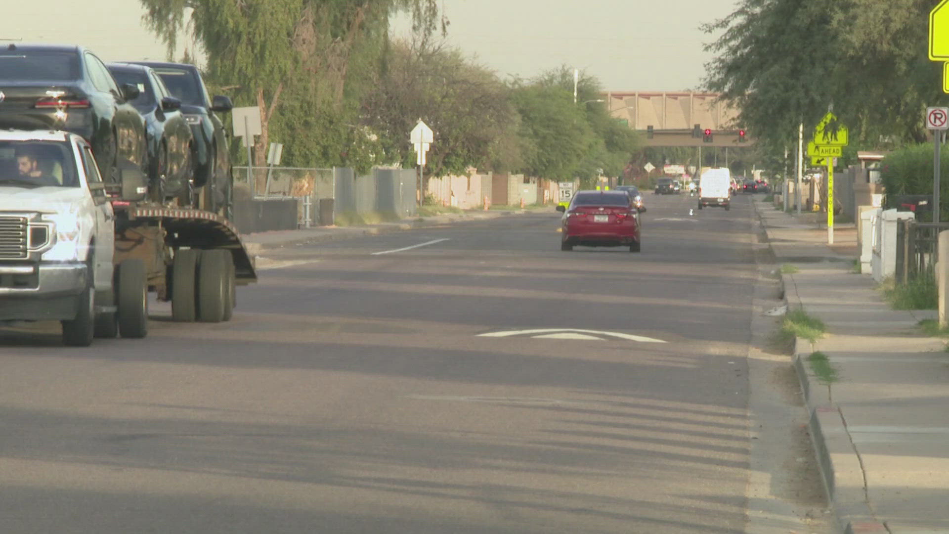 A black truck had been parked on Roosevelt Street and was running with the child in the back seat when a man allegedly got inside and drove off, police said. 