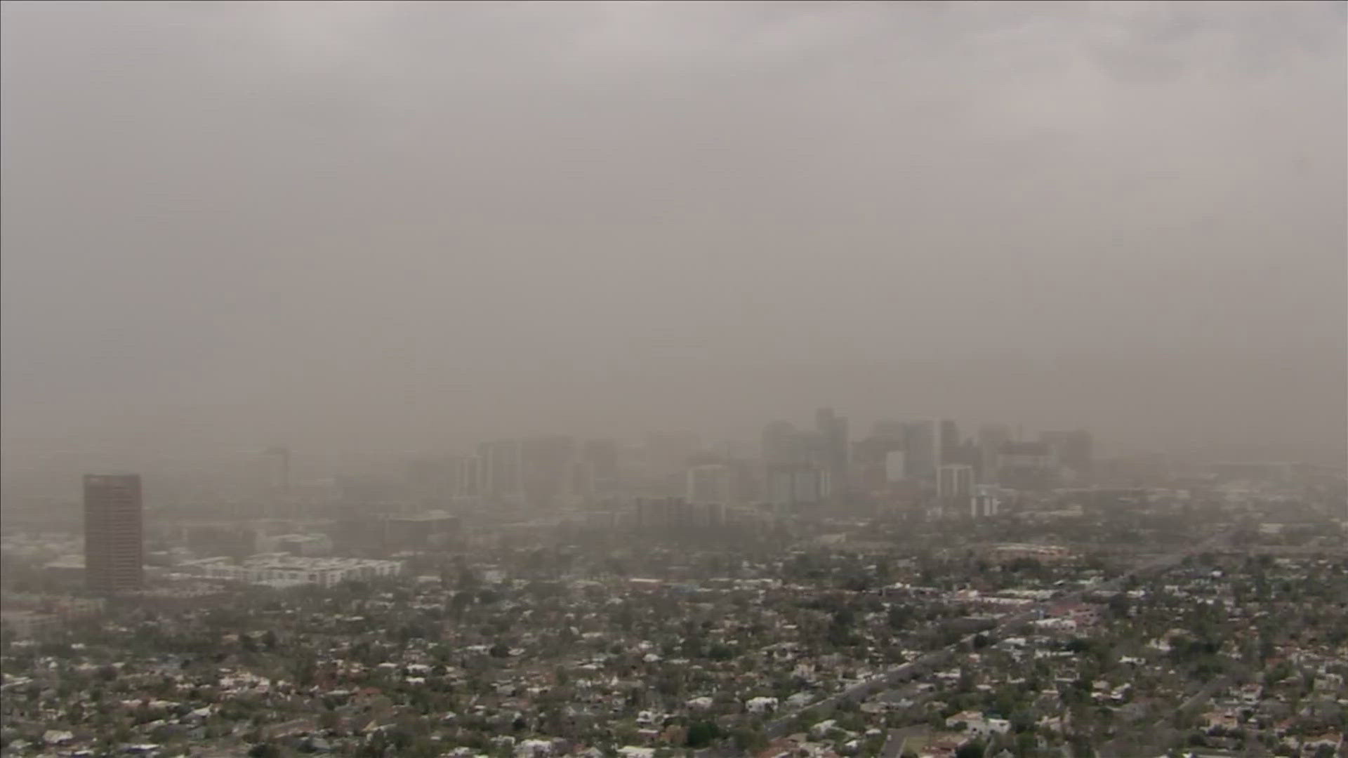 A dust storm from the southeast is headed west across the Valley.