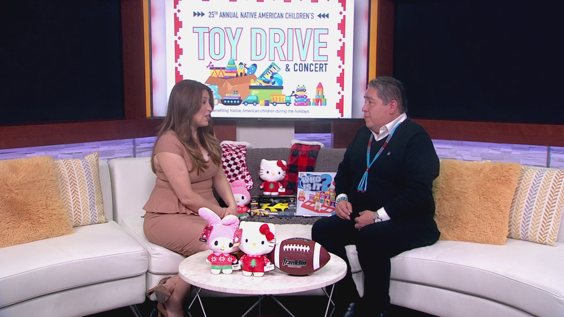 Allison Rodríguez talks with an event organizer for the 25th Annual Native American Children's Toy Drive and Concert. Here's what you need to know.