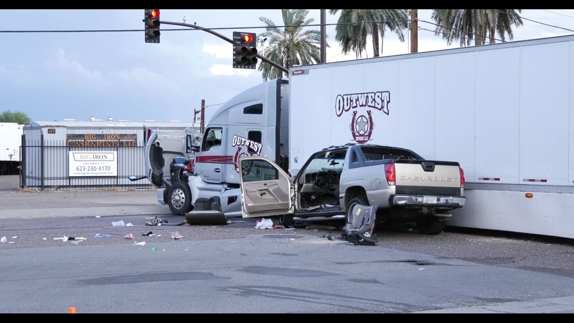2 adults, 2 kids injured after car collides with semi in Tolleson