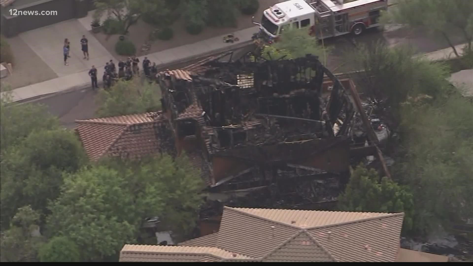 A Peoria police officer is being hailed as a hero after helping a homeowner escape a house fire early Friday morning.