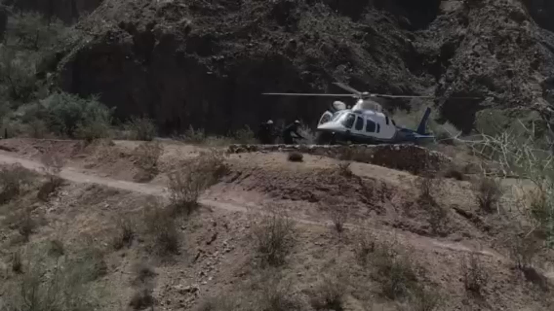 Phoenix Fire crews airlifted two hikers suffering from heat-related symptoms off of Camelback Mountain on Friday, as temperatures reached 108 degrees. (Video: Phoenix Fire Department)