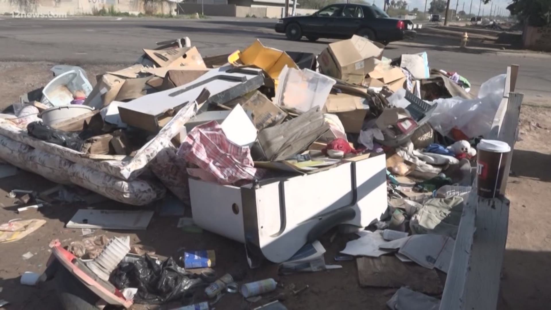 A Phoenix couple's front yard has turned into an illegal dumping ground. After 12 News spoke to city officials the trash pile has been removed.