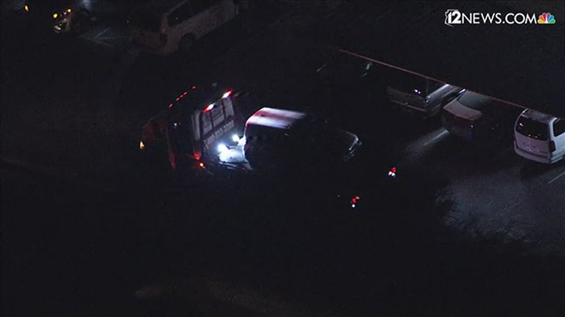 Sky 12 shows a light-colored Kia Soul being towed away from the location of a Mesa police investigation. Police confirmed the warrant was connected to a shooting.