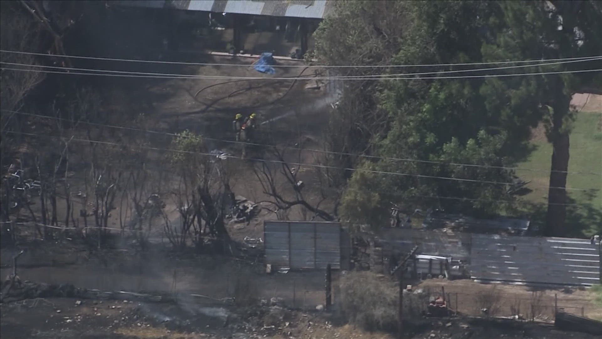 The cause of the fire is under investigation; however, a video from Sky12 showed a train stopped on the tracks a short distance from the homes.