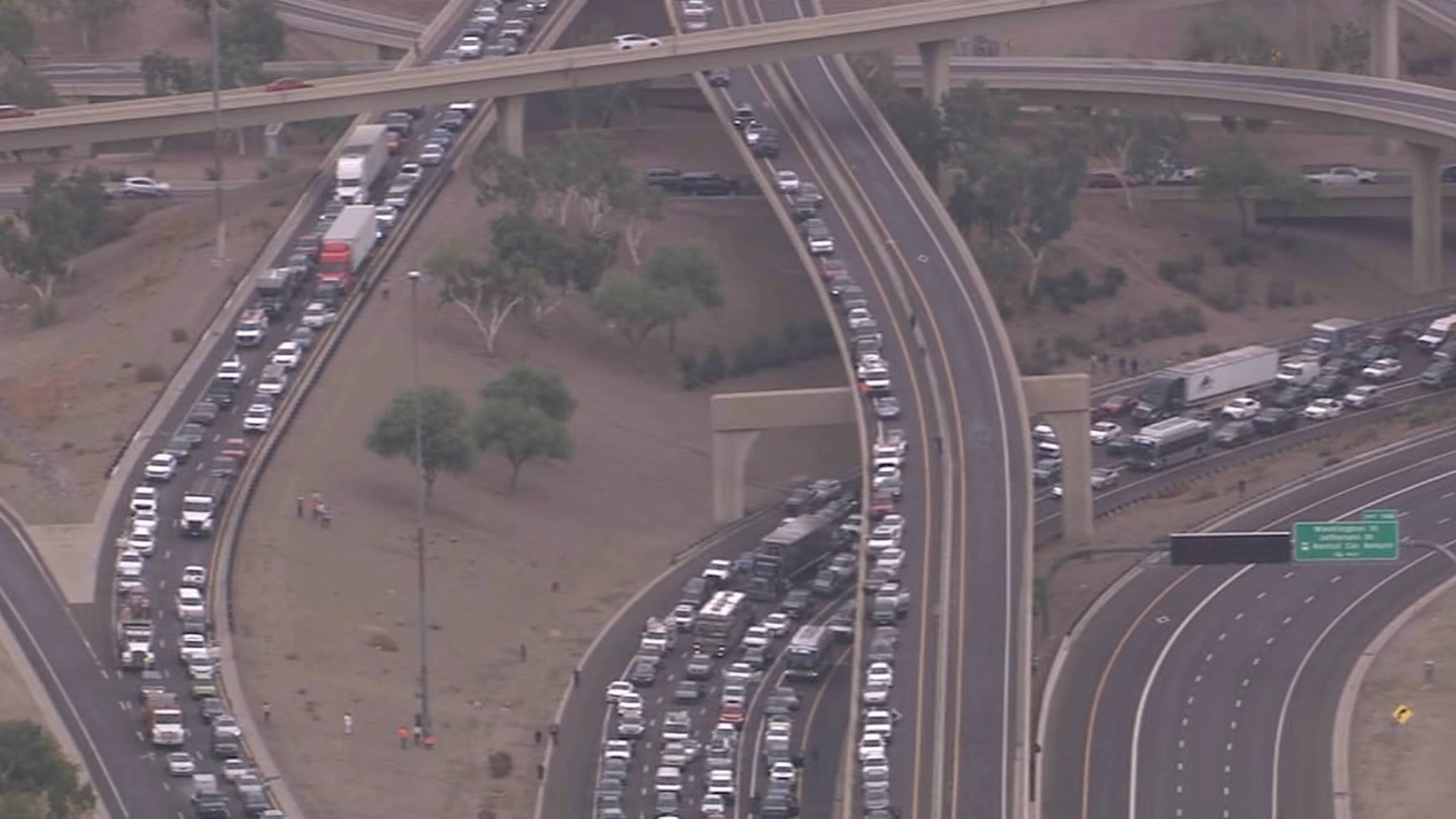 The highway was shut down in both directions due to a police situation on the pedestrian bridge above the roadway.