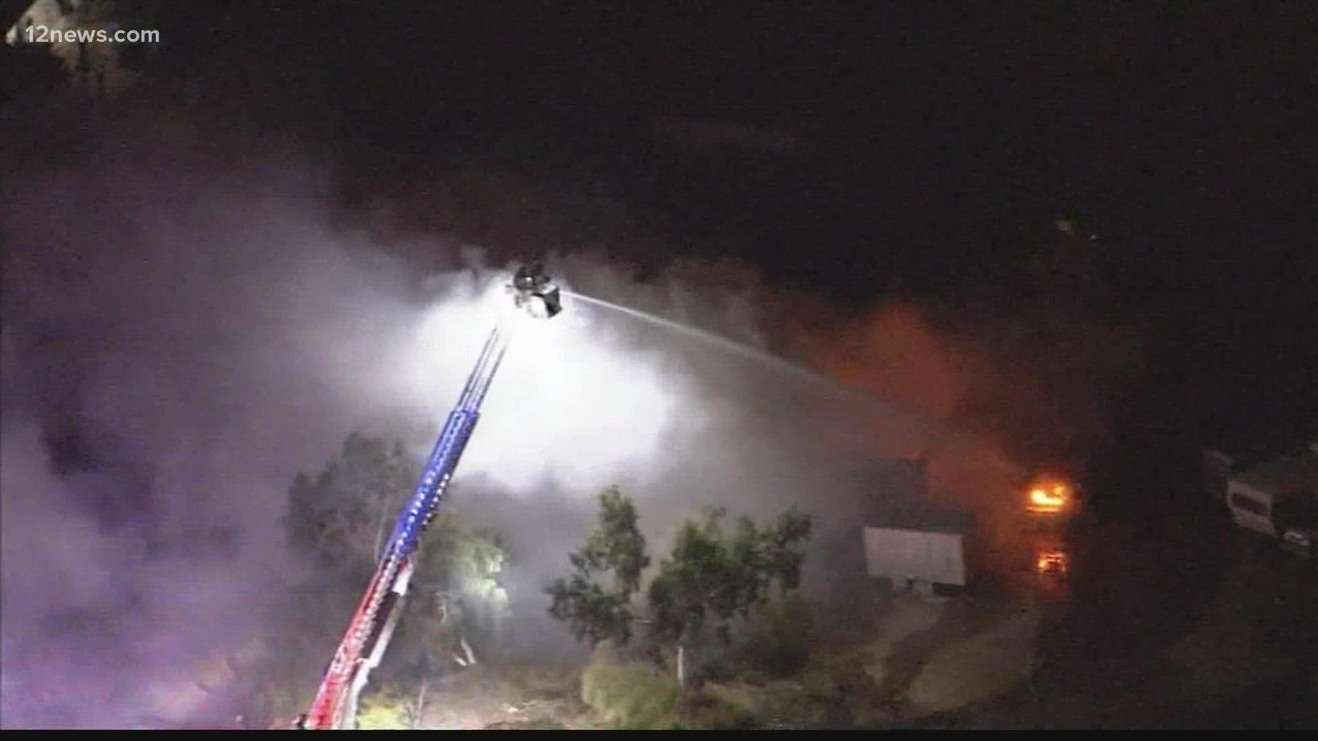 Firefighters are working to contain a massive house fire in Scottsdale Tuesday night.