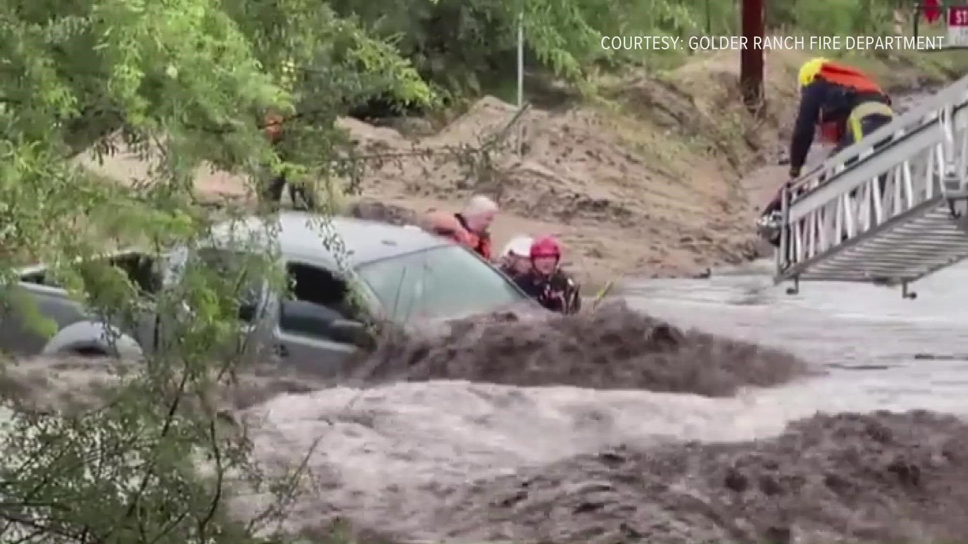 Watch how Golder Ranch fire crews rescued three people from their car during a flash flood near Tucson on Aug. 10, 2021.