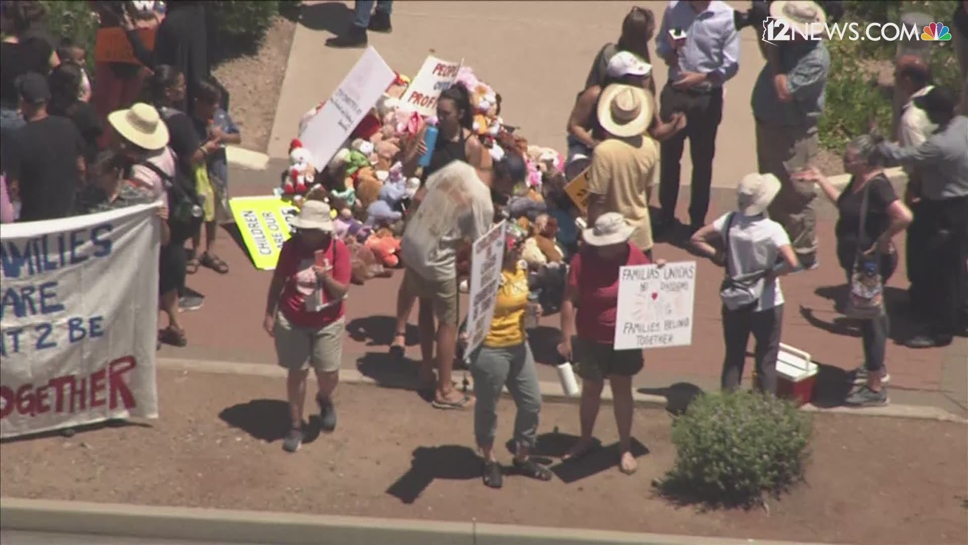 A group protesting the separation of children from their parents at the border have gathered outside Senator McCain's office in Phoenix.