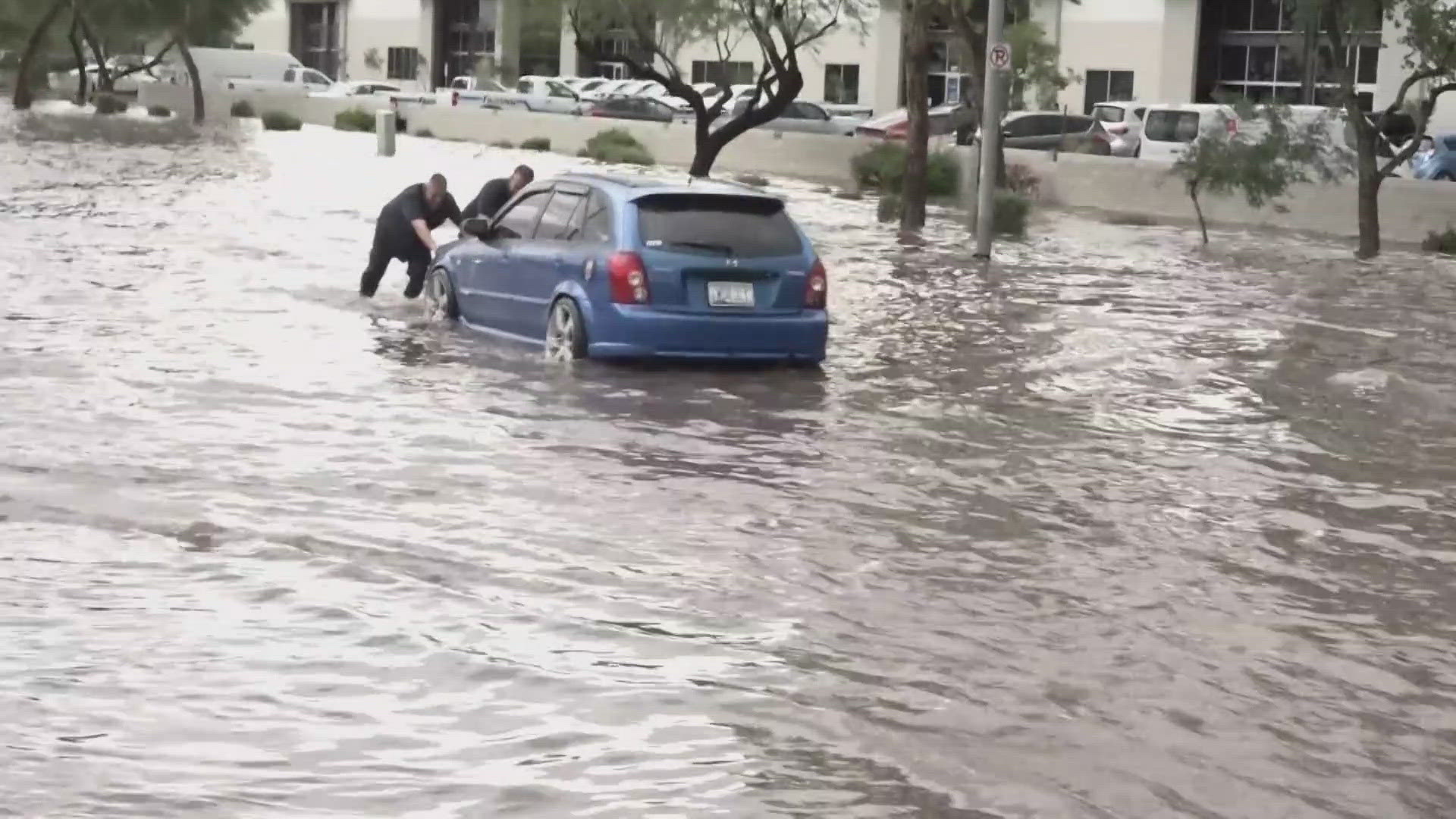 Drivers attempted to drive through flooded roads across the Valley. Some cars stalled in the water. 