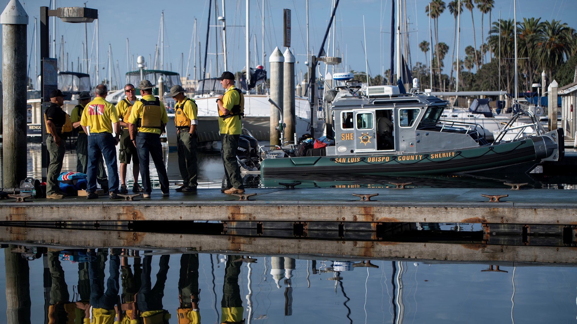 A broken-hearted mother posted on her Facebook page Tuesday that her three daughters, their father and his wife were among those presumed dead after flames engulfed a dive boat off Southern California over the holiday weekend.